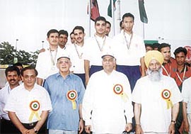 Union Ministers Yashwant Sinha and Sukhdev Singh Dhindsa and Delhi Lt. Governor Vijai Kapoor with the Indian and Bangladesh cyclists who won the 4000m team pursuit event in the SAARC Cycling Championship.