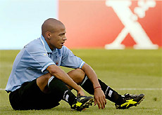 Uruguays Gustavo Varela sits alone