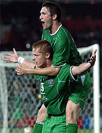 Ireland's Damien Duff celebrates with team-mate Robbie Keane