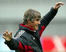 China's national soccer team coach Bora Milutinovic watches players 
