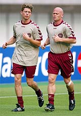Denmarks Jon Dahl Tomasson and Stig Tofting run circuits on Friday 