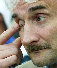 Germany's coach Rudi Voeller wipes his eye
