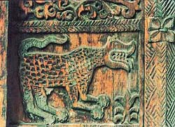 The leopard motif engraved on wood in an old temple