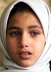Tears roll down the face of an unidentified girl