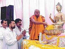 Members of the Buddh Dharam Parchar Samiti offer prayers on the occasion of Budh Purnima