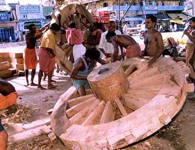 Carpenters make a new set of wheels for the famous 'rath'