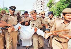 Malwinder Singh Kang, president of the Panjab University Students Union, on indefinite fast, being taken away for medical examination, in Panjab University, Chandigarh, on Monday.
