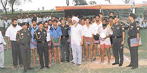 Army personnel and villagers after a volleyball match in the Amritsar sector.