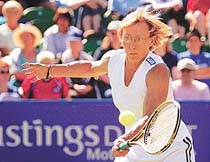 US Czech-born tennis player Martina Navratilova stretches to return a shot