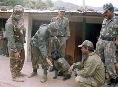 An army jawan shakes hands with their sniffer dog