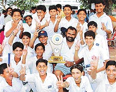 LDCA XI (A) with their coach after winning the VIth Chaman Lal Malhotra Cricket Cup Tournament 