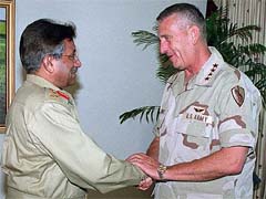 Pakistan President General Parvez Musharraf greets US General Tommy Franks