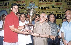 Indian Airlines captain Nikhil Chopra receiving the Lala Hari Ram Aggarwal Memorial Day-Night Cricket Tournament trophy