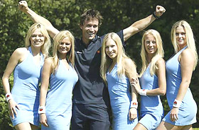 Former Wimbledon tennis champion Australias Pat Cash (3rd L) poses with five lookalikes of Russias Anna Kournikova in London, on Monday.