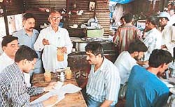 A team of food inspectors from the prevention of food adulteration cell of the General Hospital, Sector 16, collects samples from a dhaba in Sector 11 rehri market on Tuesday.