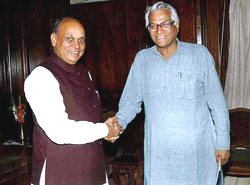 Himachal Pradesh Chief Minister Prof Prem Kumar Dhumal with Union Defence Minister George Fernandes in New Delhi on Tuesday.