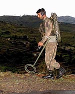 An army jawan  detects land mines 