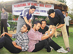 Artistes from the Sakaar Manch perform a play Shok se aadat bani on the occasion of International Day Against Drug Abuse at police lines, Sector 26, Chandigarh, on Wednesday.