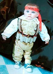 A Palestinian baby dressed like a suicide bomber