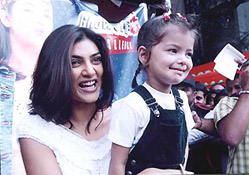 Former Miss Universe and film actress Sushmita Sen with a child