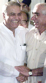 Mr Yashwant Sinha congratulates Mr Jaswant Singh after swapping portfolios as part of a government reshuffle.