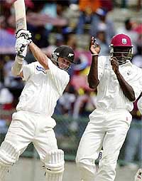 Mark Richardson of New Zealand hits a boundary
