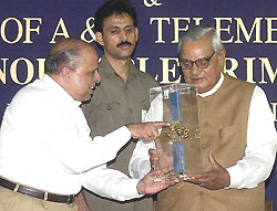 ISRO Chairman Dr K. Kasturirangan handover the INSAT-3C model 