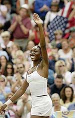 Venus Williams of the USA waves to the crowd after her semifinal victory over Belgiums Justine Henin 