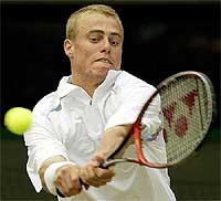 Australia's Lleyton Hewitt returns the ball to the Nertherlands' Sjeng Schalken