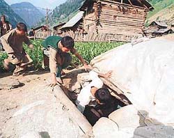 Children run for cover inside an underground bunker 