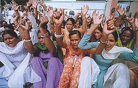 Employees of a cooperative mill hold a dharna in Bathinda