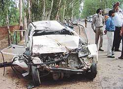 Remains of a Maruti car that collided head-on with a truck on the busy Chandigarh-Ambala highway