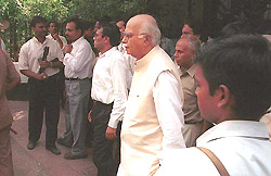 Deputy Prime Minister L. K. Advani comes out of the Ambani residence after paying his respects