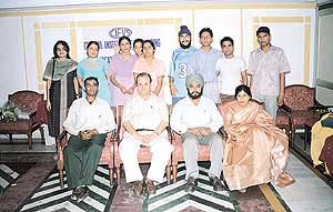 Members of the faculty of the Central Institute of Engineering and Vocational Studies, Sector 35, Chandigarh, with meritorious students at the institute on Wednesday