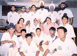Bishan Singh Bedi with young cricketers at a coaching camp