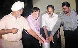Indian cricket legends Bishan Singh Bedi, Mansur Ali Khan Pataudi, Bhagwat Chandrasekhar and Kapil Dev unveiling the Timex diamond studded watch to be given to the Indian Cricketer of the Century 