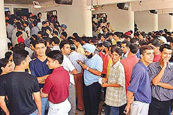 Entertainment limited, rush unlimited: Young crowd of Chandigarh waits outside a cinema hall in Sector 34 to watch first show of Devdas on Friday.