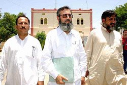 Ahmed Saeed Sheikh, centre, father of Omar Saeed Sheikh