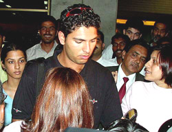Indian middle order batsman Yuvraj Singh is surrounded by fans
