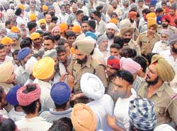 Mr Naunihal Singh, Superintendent of Police (City-II), tries to pacify an agitated mob