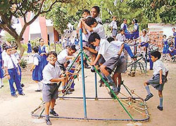 BACK ON RAILS: Students of IS Dev Samaj Senior Secondary School, Sector 21, in a playful mood in the school on Tuesday.