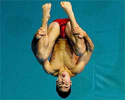 Alexandre Despatie from Canada dives during the mens one metre springboard preliminaries 