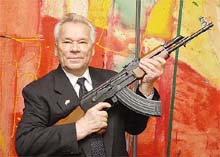 Russian weapon constructing engineer Mikhail Kalashnikov presents a submachine gun
