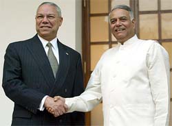 US Secretary of State Colin Powell (left) shakes hands with Foreign Minister Yashwant Sinha