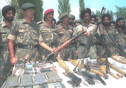 Army officers at a camp in Baramulla display arms and ammunition
