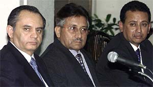 Pakistani President Pervez Musharraf flanked by his Commerce Minister Abdul Razzaq Dawood and Bangladesh Commerce Minister Amir Khasru Mahmud Chowdhury 