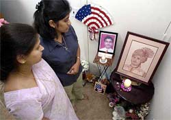Shifali Agarwal and Sonia Gawas look at a small shrine