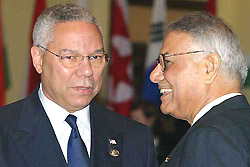 US Secretary of State Colin Powell chats with his Indian counterpart