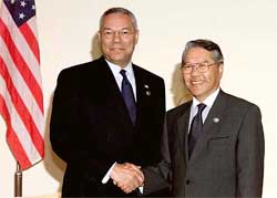 US Secretary of State Colin Powell greets his South Korean counterpart