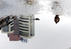 A policeman stands close to the Bombay stock exchange